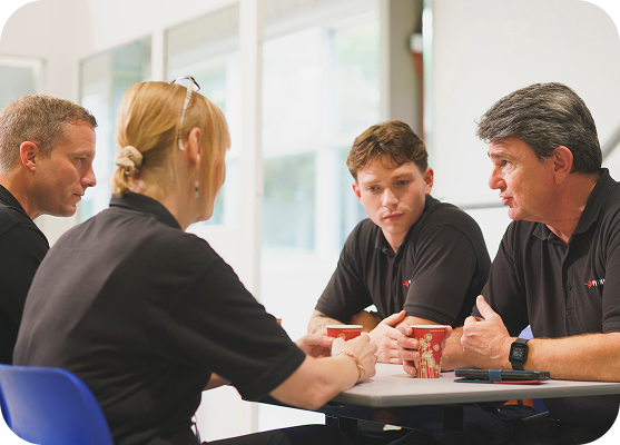 Team members discussing ideas during a collaborative workplace meeting.