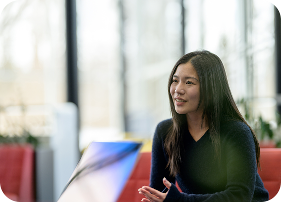Employee speaking during a collaborative team discussion.