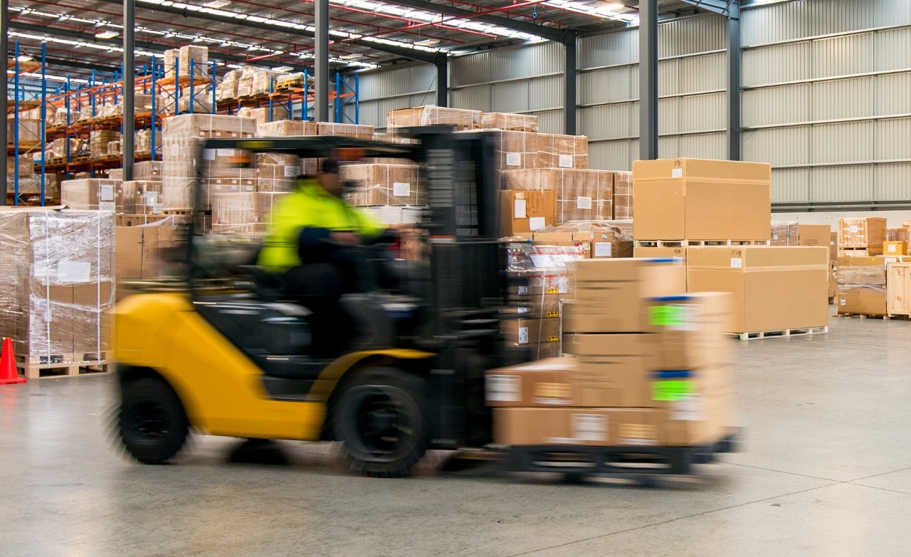 Partner warehouse with forklift truck at work